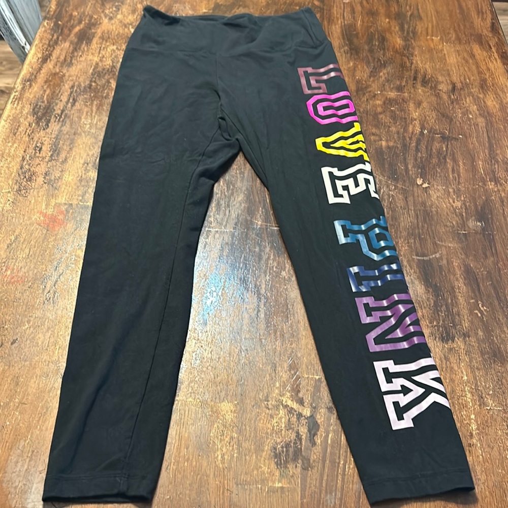 Black PINK brand leggings with rainbow logo